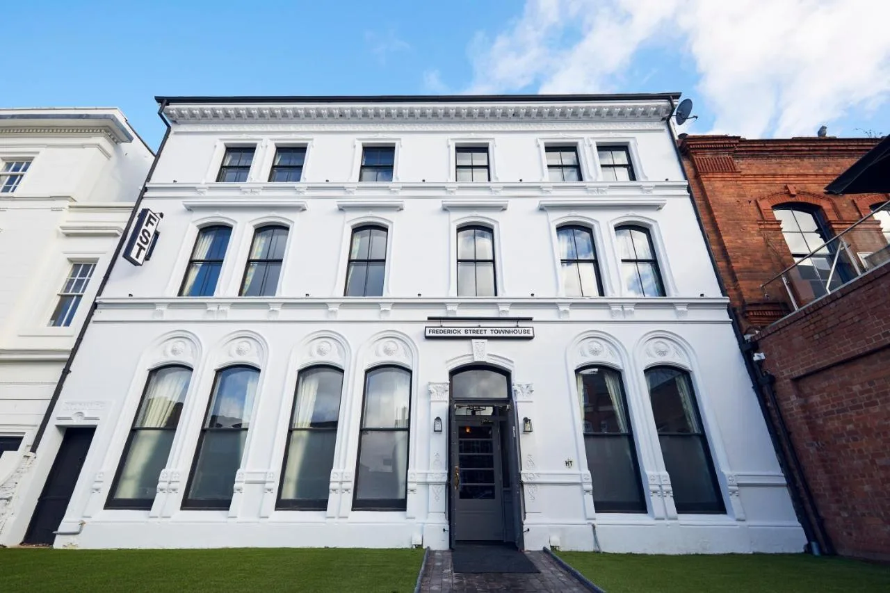 A white building with a door in front of it at Frederick Street Townhouse in Birmingham