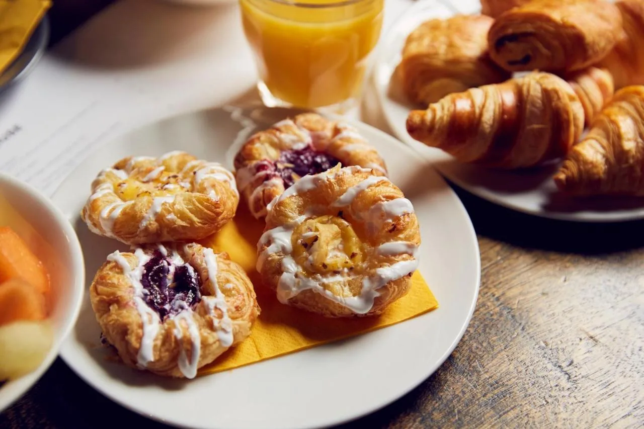 A plate of donuts and other pastries on a table at Frederick Street Townhouse in Birmingham