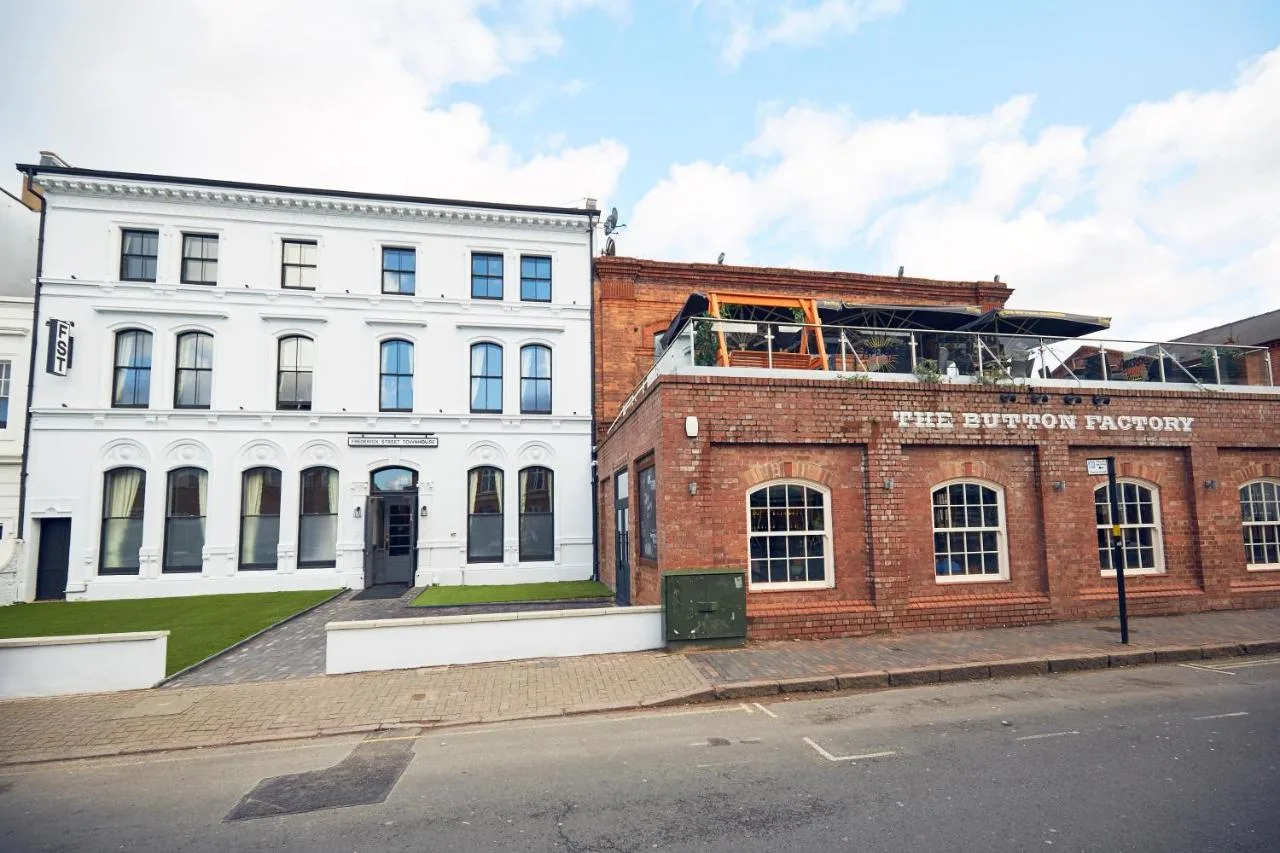 A large white building on the side of a street at Frederick Street Townhouse in Birmingham